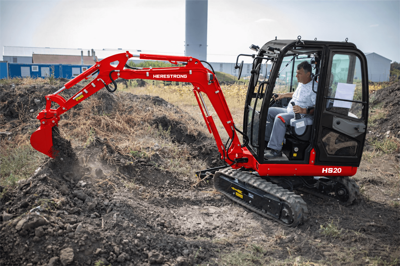 HERESTRONG HS20 compact excavator at work on a customer jobsite