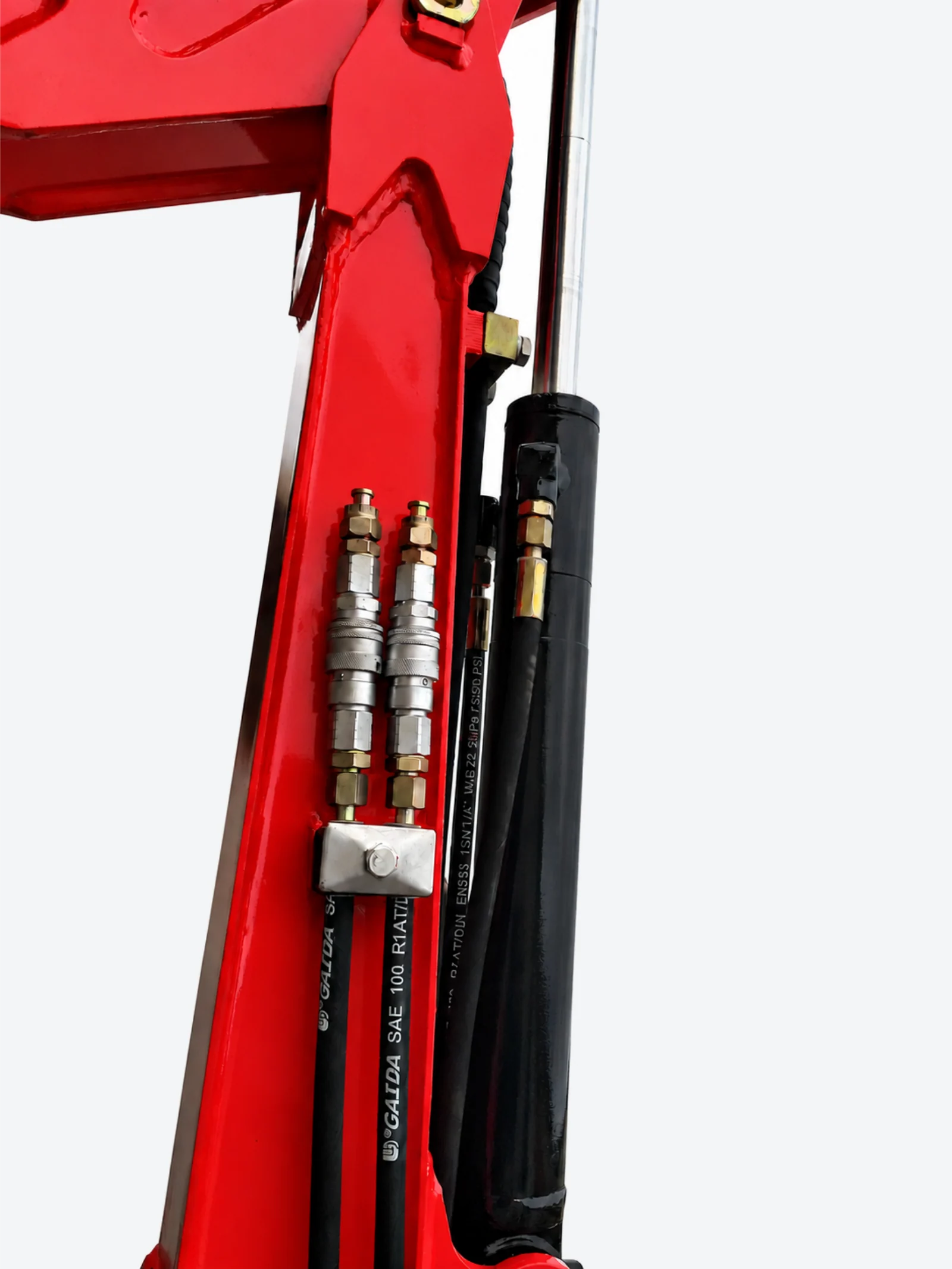 HS10 auxiliary hydraulic hose connections beside the arm cylinder